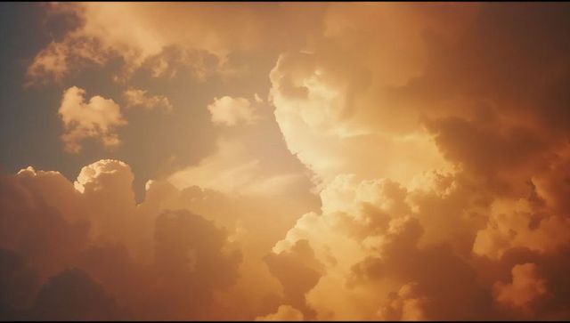 Dramatic golden cumulus clouds at sunset