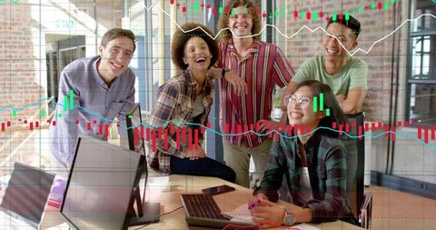 Young diverse team laughing during finance meeting with stock chart overlay