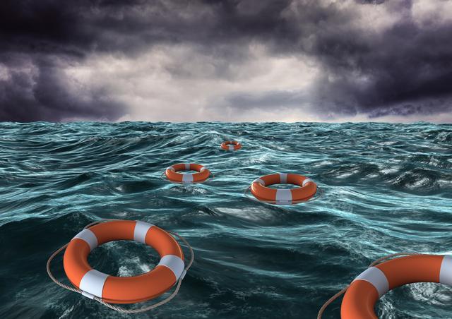 Lifebuoys are floating on a stormy sea, highlighting a life-saving emergency in rough waters. The dark, turbulent clouds accentuate the dramatic and urgent atmosphere. This image is perfect for illustrating themes of maritime safety, emergency preparedness, and rescue operations. It can be used in educational materials, safety guidelines, and awareness campaigns.