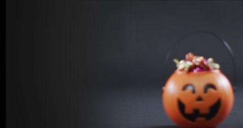 Cute Halloween Pumpkin Bucket with Colorful Candy Treats - Download Free Stock Images Pikwizard.com