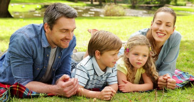 Happy Family Enjoying Leisure Time Outdoors in Park - Download Free Stock Images Pikwizard.com