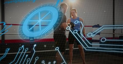 Coach adjusting gloves on female boxer wearing blue tank in ring with augmented hud overlay