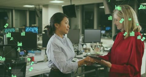 Business professionals shaking hands with digital concept overlay