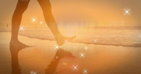 Serene Beach Walk at Sunset with Sparkling Reflections