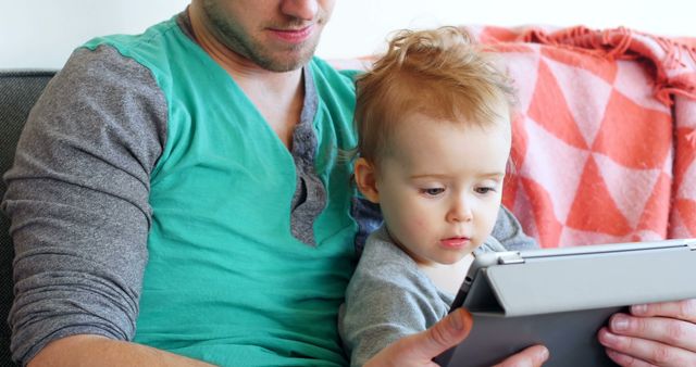 Father and Toddler Using Tablet Together at Home - Download Free Stock Images Pikwizard.com