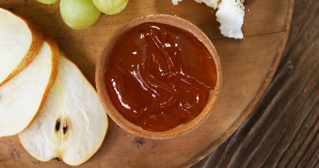 Close-up of Fruit Jam with Sliced Pears and Cheese on Wooden Tray - Download Free Stock Images Pikwizard.com