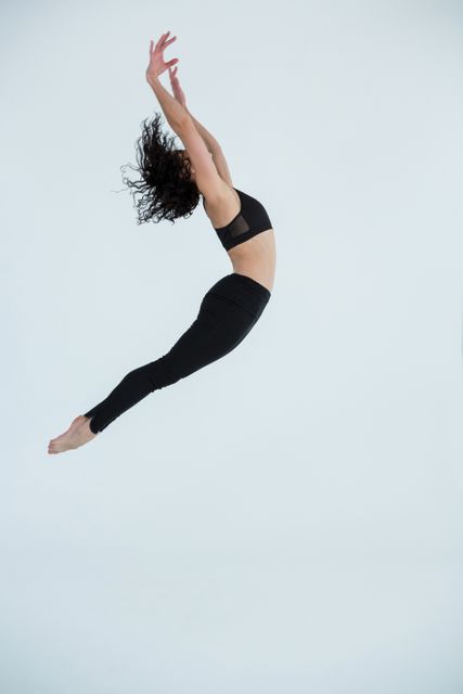 Contemporary Dancer Leaping in Studio - Download Free Stock Photos Pikwizard.com