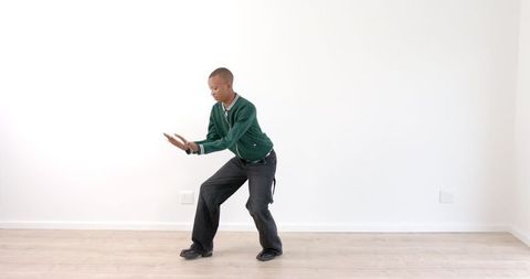 Young Man Practicing Indoor Fitness Exercise on Wooden Floor - Download Free Stock Images Pikwizard.com