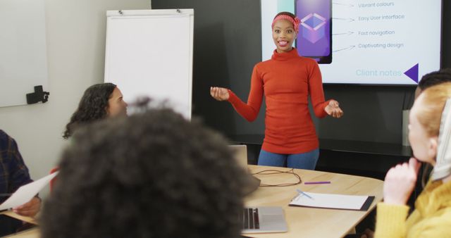 Young Woman Presenting in Office Meeting with Multiracial Team - Download Free Stock Images Pikwizard.com