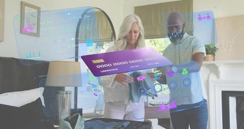 Senior couple packing suitcase using augmented reality wardrobe assistant and virtual card