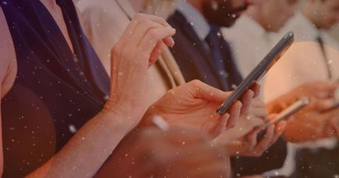 Business People Using Smartphones with Snowfall Effect
