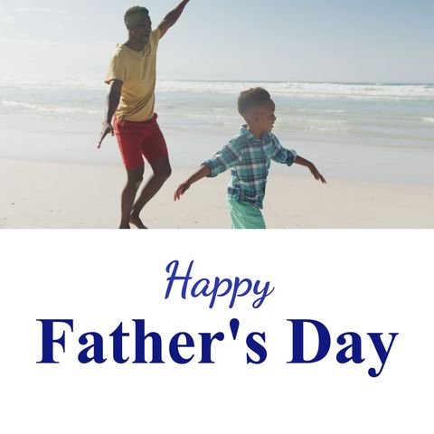 Father and Son Enjoy Playing at Beach on Father's Day