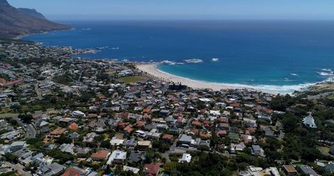 Scenic coastal town with mountain views