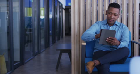 Business Professional Using Tablet in Modern Office