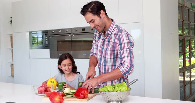 Father and Daughter Preparing Salad in Home Kitchen - Download Free Stock Images Pikwizard.com