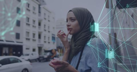 Woman in Hijab Integrating Technology into Urban Life