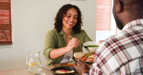 Couple enjoying casual healthy meal at home