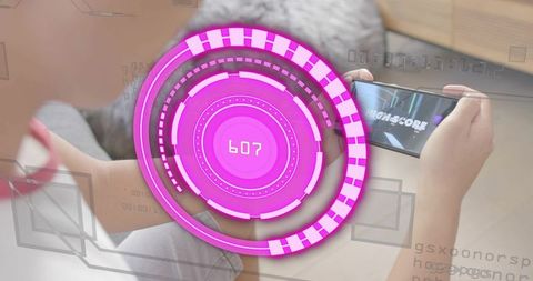 Asian man playing mobile game on rug with magenta hud high-score neon ar overlay