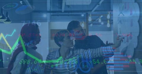 Diverse Team Analyzing Data Visualizations in Office