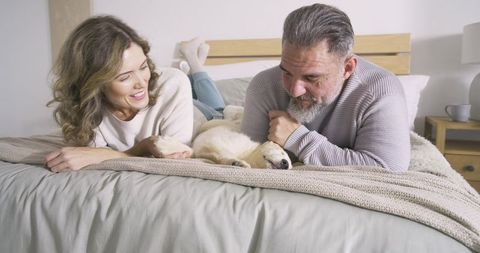 Couple enjoying quiet moment with sleeping puppy