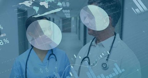 Clinicians Walking and Reviewing Digital Health Dashboard in Hospital Corridor