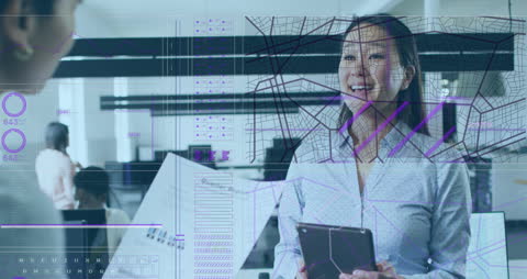 Businesswoman in Office Analyzing Digital Data Interface