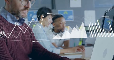 Business team analyzing graphics on laptop with futuristic interface