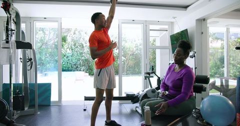 Couple Exercising Together at Home Gym with Modern Equipment