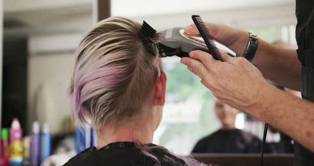 Hairdresser Giving Modern Haircut With Clipper to Young Woman - Download Free Stock Images Pikwizard.com