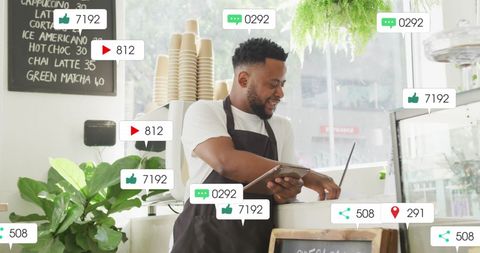 Tech-Savvy African American Barista in Coffee Shop Analyzing Digital Data