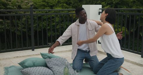 Couple Sharing Warm Embrace on Outdoor Patio Afternoon