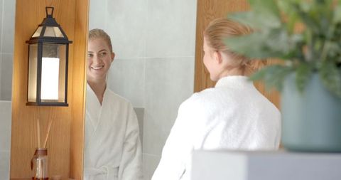Woman in Plush Bathrobe Enjoying Spa-Inspired Bathroom