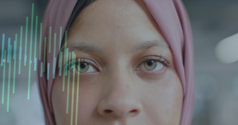 Financial Data Graphics Overlay on Diverse Professional Woman