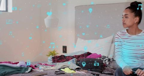 Young woman packing smart luggage with augmented reality travel icons overlay