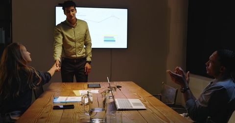 Business professionals collaborating on project presentation