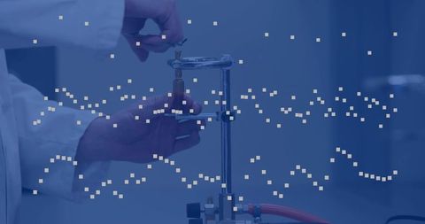 Technician adjusting gas valve on laboratory apparatus with digital pixel data overlay