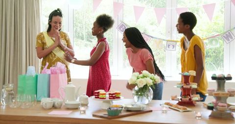 Diverse Women Celebrating Joyous Birthday Party with Gifts