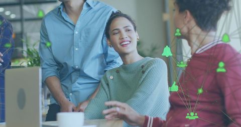 Colleagues Discussing Social Media Strategy in Modern Office