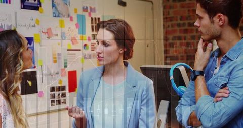 Leading team through collaborative brainstorming with sticky notes and data visualization