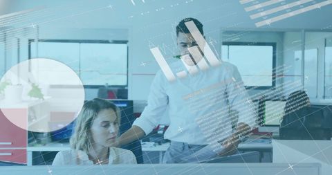 Colleagues Collaborating with Digital Data Diagrams in Modern Office