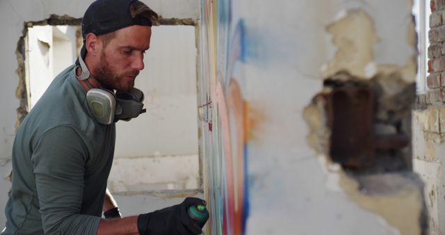 Urban Artist Creating Graffiti on Abandoned Building - Download Free Stock Images Pikwizard.com