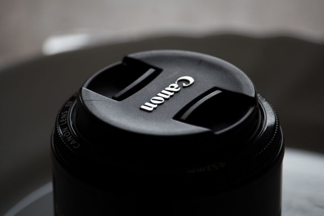 Close-Up Photograph of Canon Lens Cap on Camera - Download Free Stock Images Pikwizard.com