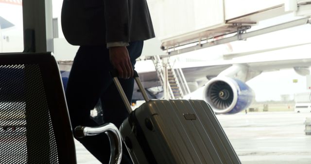 Business Traveler Walking with Luggage in Airport Terminal - Download Free Stock Images Pikwizard.com