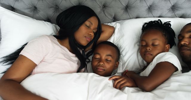 Peaceful African-American Family Sleeping Together in Bed - Download Free Stock Images Pikwizard.com