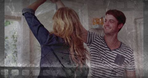 Young Couple Twirling in Bright Minimalist Home for Leisure and Romance