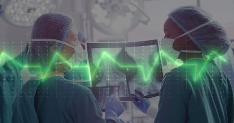 Surgeons Consult Over X-Ray with Cardiograph Overlay - Download Free Stock Images Pikwizard.com