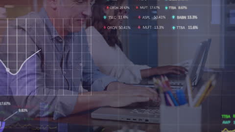 Businessman Analyzing Data on Laptop with Stock Market Graphics