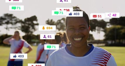 Smiling mid adult soccer player in team jersey with floating social media alerts and icons