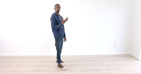 Young Man Practicing Dance in Bright Empty Room - Download Free Stock Images Pikwizard.com