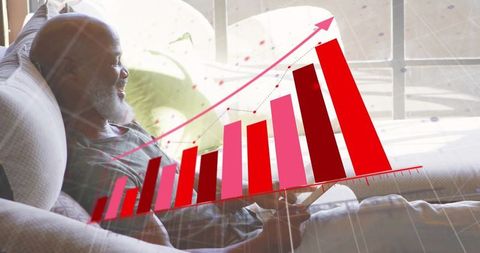 Senior man analyzing growth chart on tablet at home in relaxed atmosphere